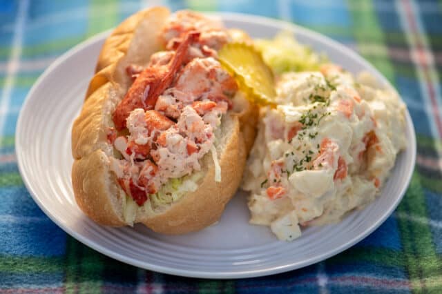 classic a nova scotia lobster roll served with potato salad