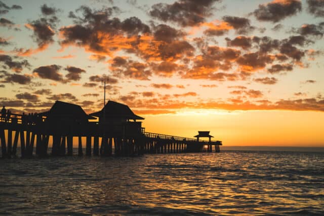sunset of naples beach pier, florida