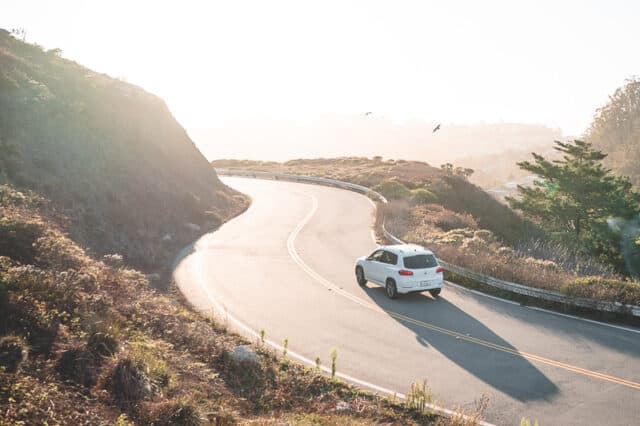 road tripping in a car driving on mountain road